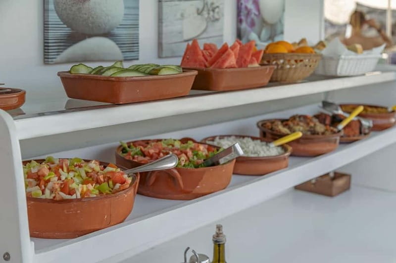 Cala Rajada: Boat Excursion with Drinks and Food - Crew energy, a fun captain, and those fish-and-seagull moments