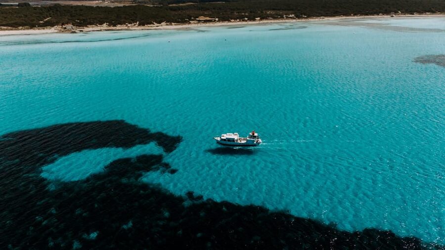 Colònia de Sant Jordi: Es Trenc Boat Tour with Snorkeling - Onboard Comfort: Music, Bathrooms, and Real Time to Relax