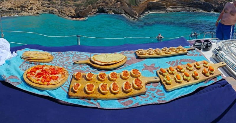 From can Pastilla : Sailing boat trip with Food & Drinks - Snorkeling set, paddle surf, and how the boat supports both