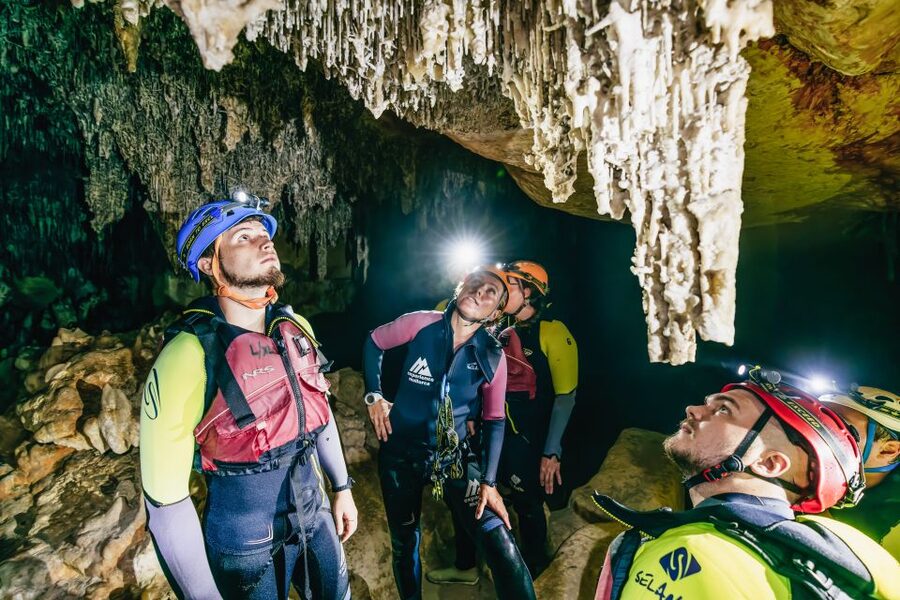 Mallorca: Cova des Coloms Caving Trip with Hotel Transfer - Inside Cova des Coloms: Limestone Formations and Cave Lake Swimming