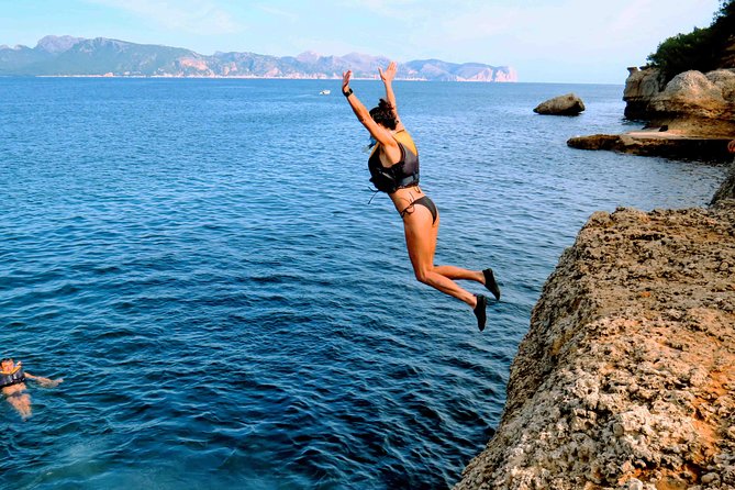 Mallorca: Kayaking, Sea Cave, Cliff Jumping & Snorkel Tour - Coastal trekking plus optional cliff jumping