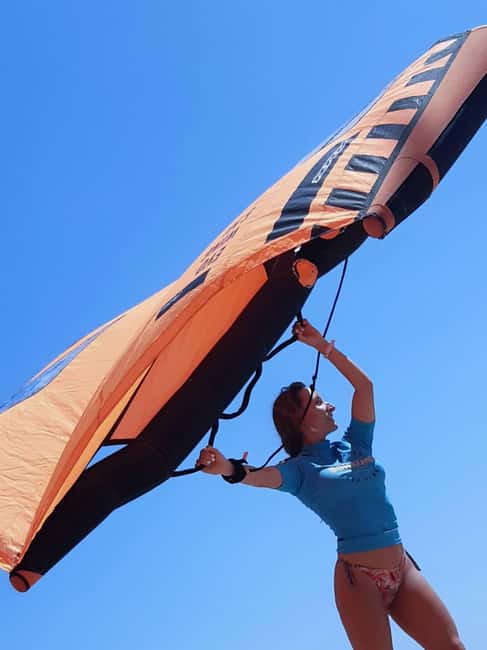 Mallorca: Wing Foil Lesson (60min) - Entering the water with BonaOna Surf School in Mallorca