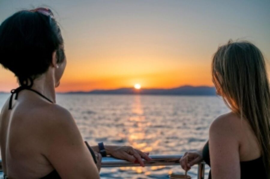 S'Arenal: Sunset Catamaran Cruise with BBQ - Cala Vella and the protected-cove stop for swimming and snorkeling