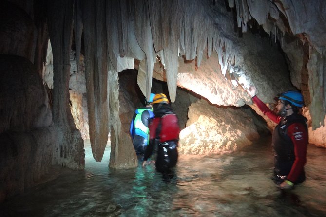 Swimming and Caving in Cova des Coloms - Suit up for wetsuits and helmets: what you get and what costs extra